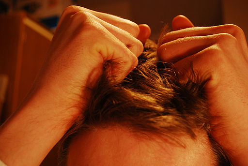 Photo of stressed out person pulling hair