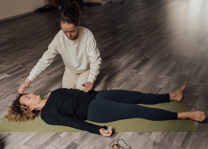 Photo of an energy healing in session Photo of energy healing in process