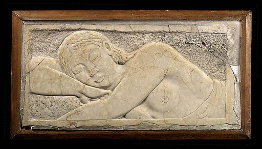 Carving of sleeping man